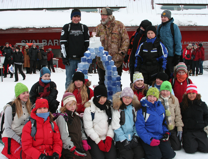 School pupils and artist Olaf Storø with ice sculpture in front of Svalbard Science Centre